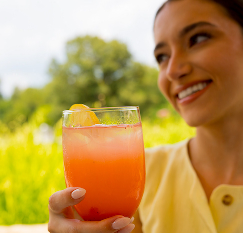 women holding a martini drink