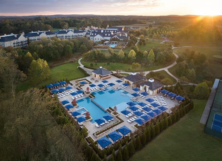 Resort pool aerial at sunrise
